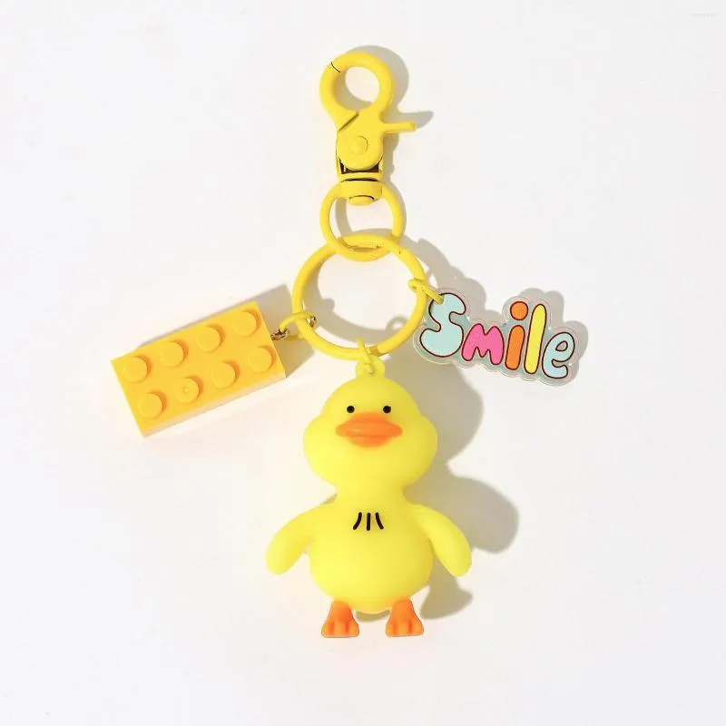 Bracelets porte-bonheur DCARZZ mignon canard porte-clés bijoux dessin animé Kawaii paquet pendentif décoration pour femmes porte-clés sac clés de voiture