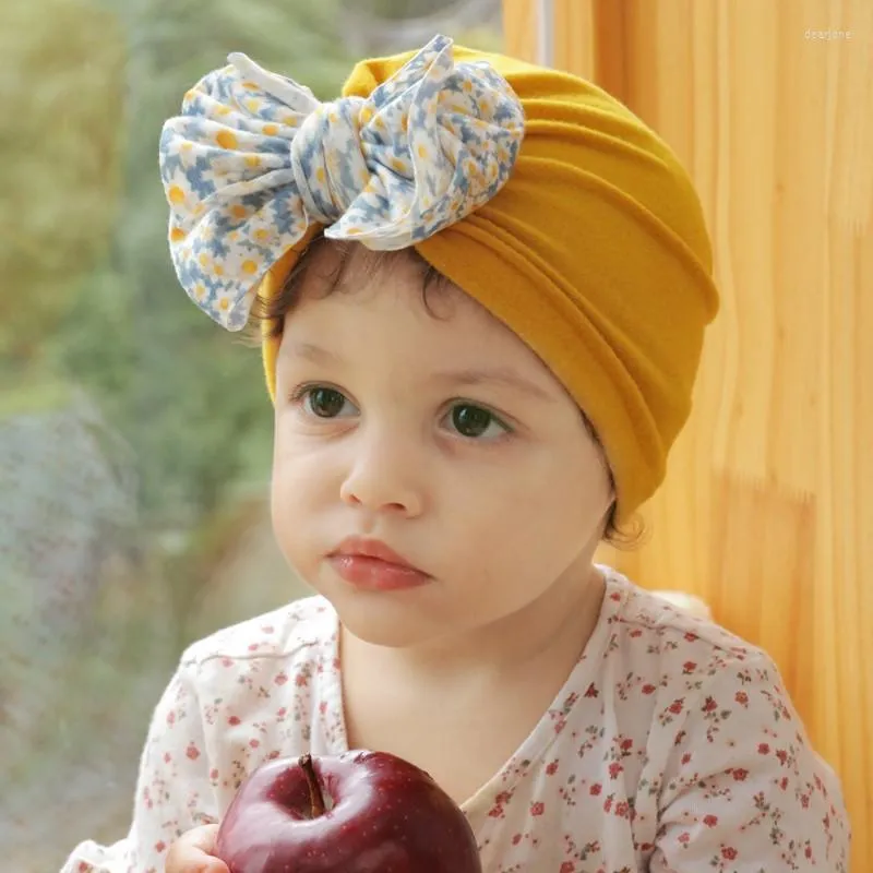 帽子生まれた女の赤ちゃんの帽子綿プリント弓ビーニースプリングウォームフードキャップ