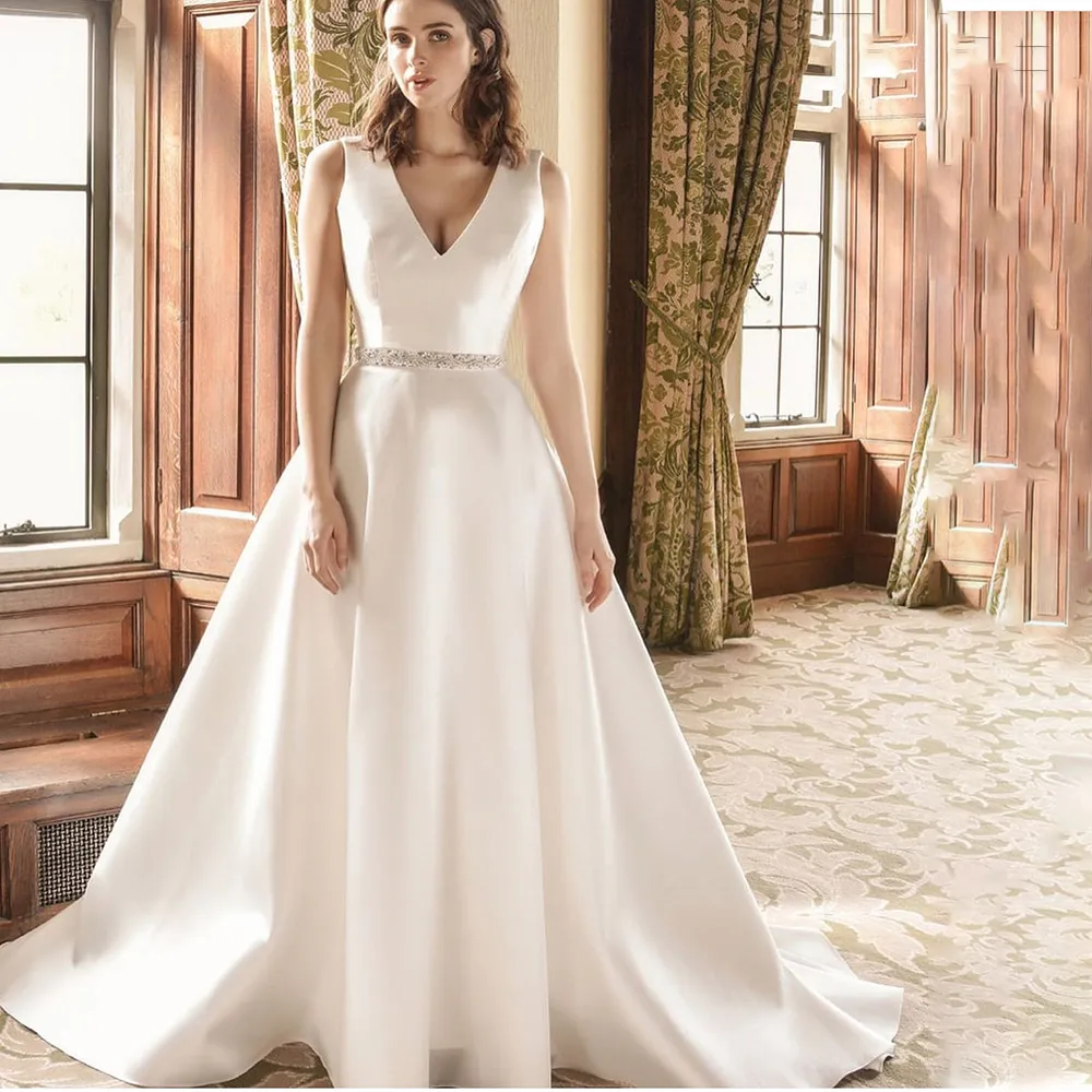 Simple Satin V Neck A Line Backless Sleeveless Wedding Dress with Beaded Embellishments from Dhgate A-Line Wedding Dresses - price 117.63 Simple Satin V Neck A Line Backless Sleeveless Wedding Dress with Beaded Embellishments from Dhgate A-Line Wedding Dresses - price 117.63