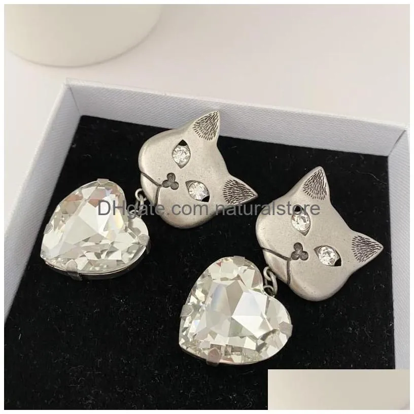 Clip-On Screw Back Backs Boucles d'oreilles 2022Ar Européenne Et Américaine Bijoux De Mode Sier Métal Chat Coeur Diamant Pendentif Pour Les Femmes Birt Dhona