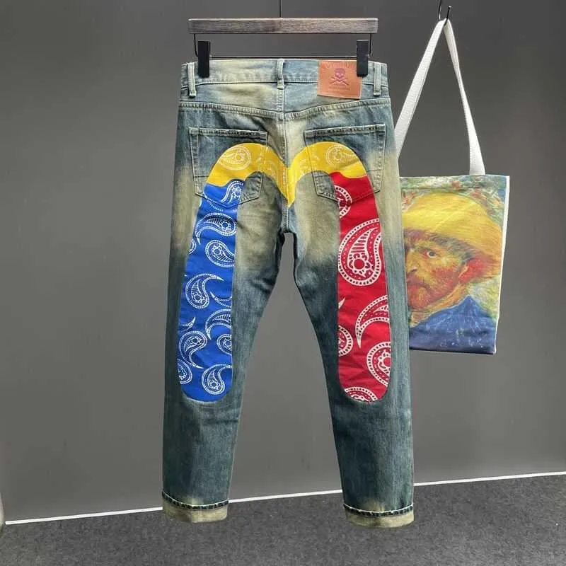 Calça jeans de jeans EVOSUE MAN PONTES EMPENHO MAN SKELETEN PROMUTADO Bordado de limpeza de calças de luta de streetwear Roupas de jeans para homens evisue Baggy