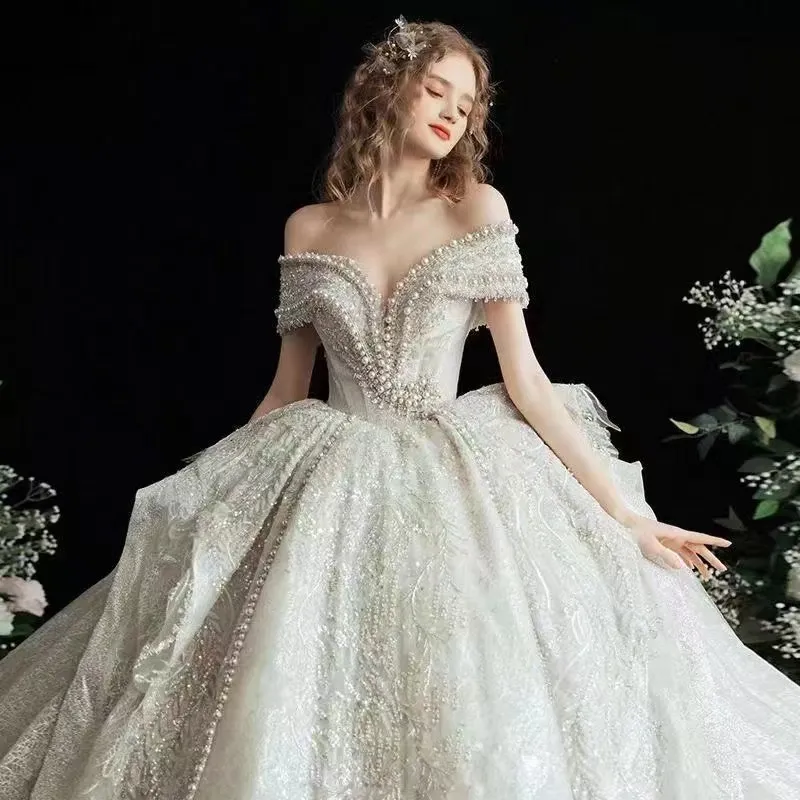 Dubaï une ligne robes de mariée, plus la taille chapelle train chérie cristal robe de novia diamant perlé hors épaule Appliqued robes de mariée de mariée sur mesure