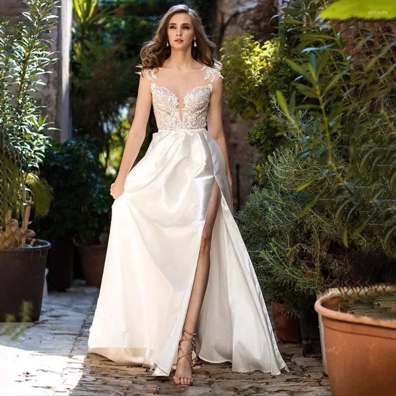 Robe de mariée élégante Satin Sexy col rond A-ligne dentelle Appliques mancherons côté fendu Illusion dos avec bouton robe de mariée