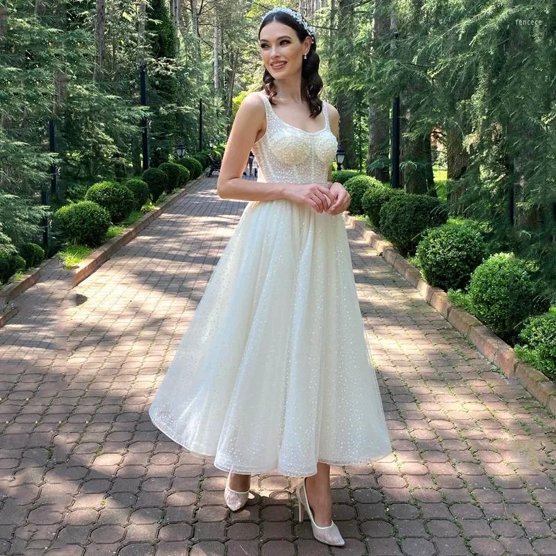 Abito da sposa Otto abiti eleganti Glitter senza maniche in tulle Sposa con fiocco Lunghezza tè Abiti a trapezio Taglie forti