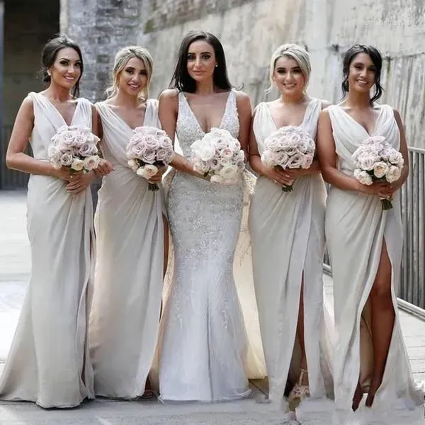 Elegant Beige Chiffon Bridesmaid Dress: V-Neck, Side Slit, Ruched - Shop Now! Plus Size Options Available Elegant Beige Chiffon Bridesmaid Dress: V-Neck, Side Slit, Ruched - Shop Now! Plus Size Options Available