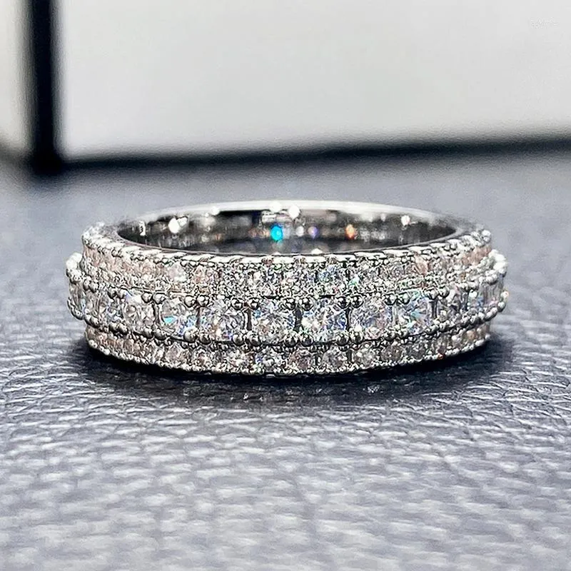 結婚指輪caoshiスタイリッシュなレディは、立方体ジルコニアのファッションエンゲージメントアクセサリーで指輪を輝かせますデリケートデザインジュエリー