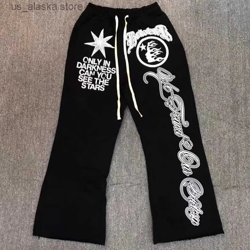 Pantaloni da uomo Pantaloni neri della tuta Hellstar Classic Flame Star Pantaloni con stampa a lettere American Hip Hop Casual Loose Uomo Donna Bell Bottoms T230801