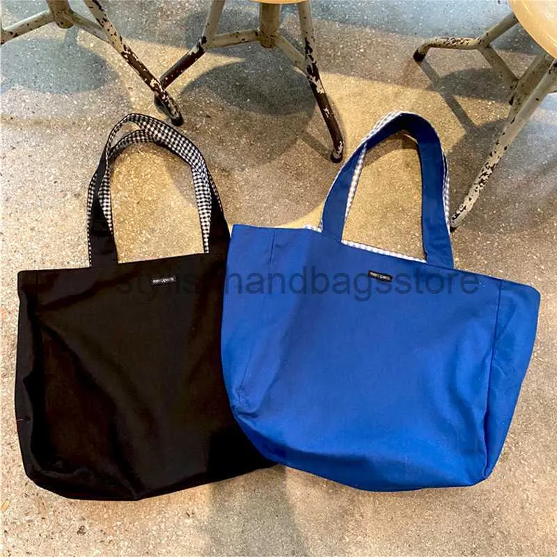 Bolsa de ombro feminina Totes Lona 2023 Bolsa de mão de grife Lazer feminino Sólida Bolsa de compras com fundo plano Bolsa de grande capacidade com dois lados elegantesbolsas de mãoloja