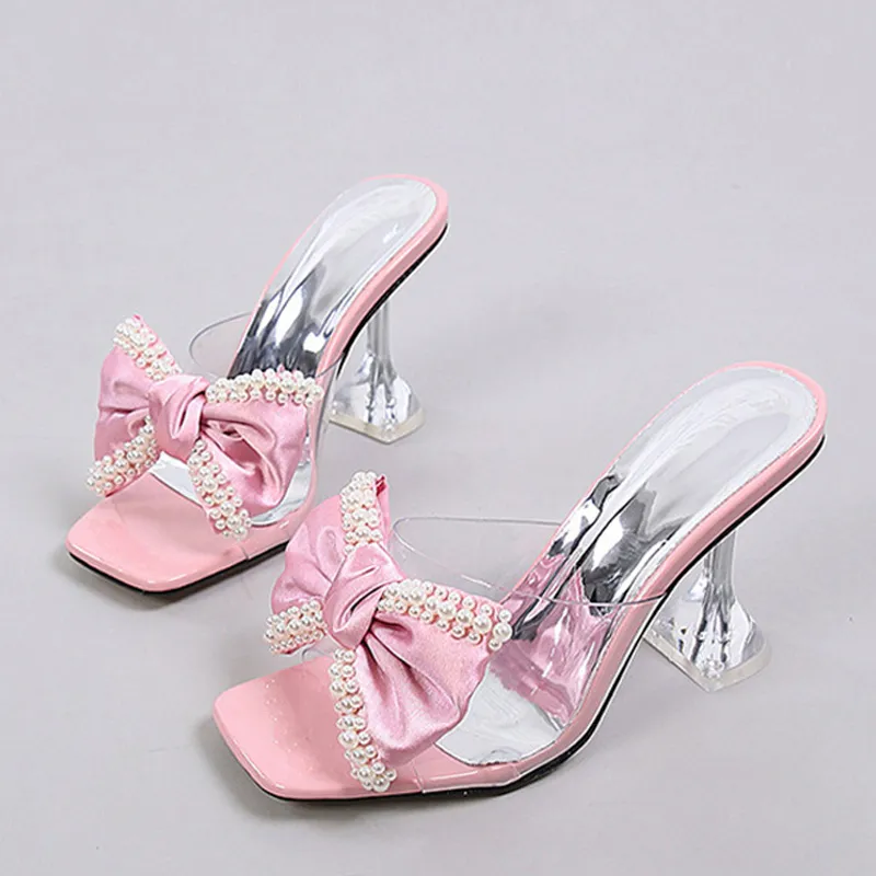 Sandaler liyke stil rosa kvinnor tofflor sandaler mode pärla bowknot höga klackar pvc transparenta skor sommar mule glider pumpar 230802