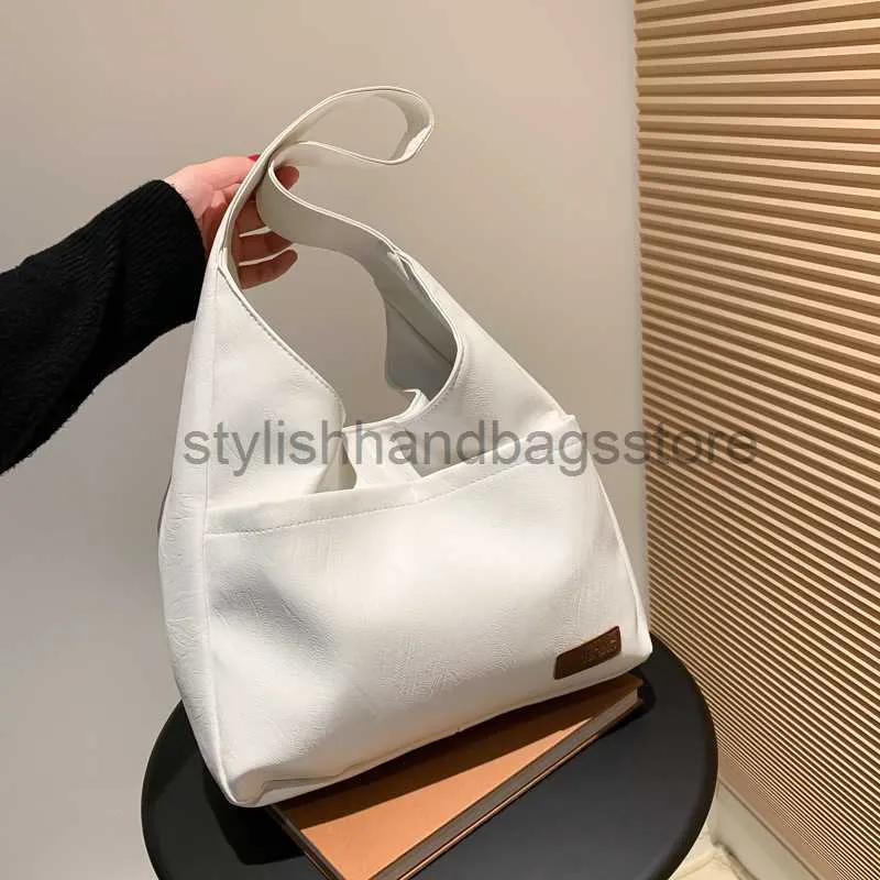 Bolsos de hombro Bolso de textura de estudiante Mujer Otoño 2023 Nueva tendencia de moda Bolso grande INS Bolso de axila de gran capacidad Mujerestilobolsos de mano