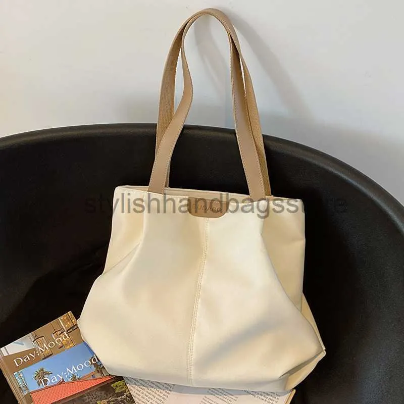 Borse a tracolla Grande capacità Moda Versione coreana Borsa per pendolari per donna Estate 2023 Nuova borsa alla moda Borsa in tela Trucco Tote Bagsstylishhandbagsstore