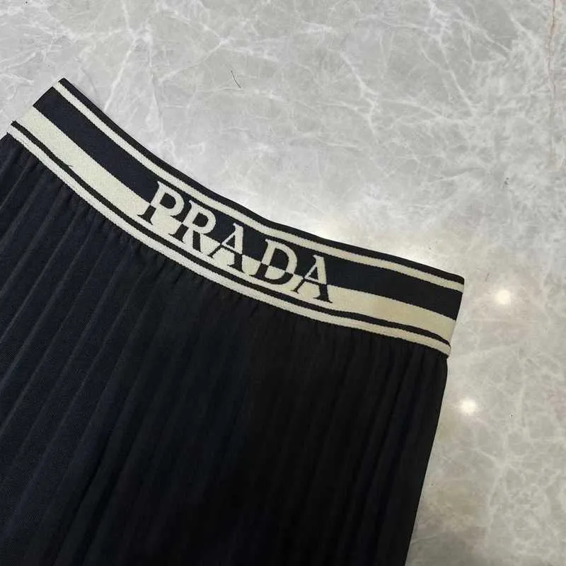 Skirts Designer P Family 23 Spring/Summer New Temperament Casual Letter Ribbon High Waist Slim Pleated Skirt Mid length Half NEGI