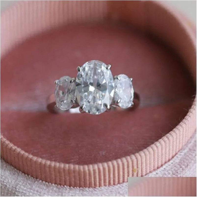 Headpieces mais vendidos de alta qualidade moda anel jóias 925 anéis de prata esterlina oval branco 5A zircônia cúbica diamante eternidade mulheres B Dhasy