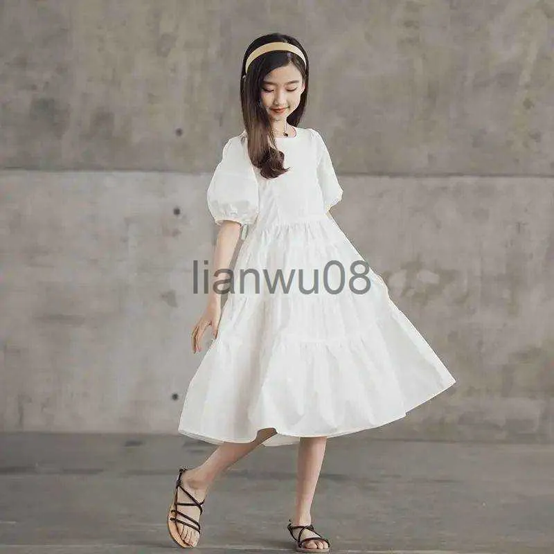 Flickans klänningar 2023 Girls Summer White Dresses Solid Cotton Swing Dress Puff Sleeve Casual Teenager Children Kläder Ruffles 8 9 10 11 12 År x0806