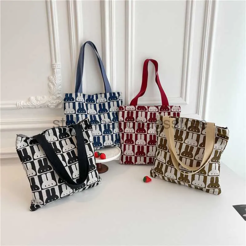 Umhängetaschen 2023 Neue Kaninchen Cartoon Kreative Handheld Woven Tasche Große Kapazität Tasche Koreanische Version Einfache Einkaufen Leinwand Tasche Frauen taschenstyleshhandbagsstore