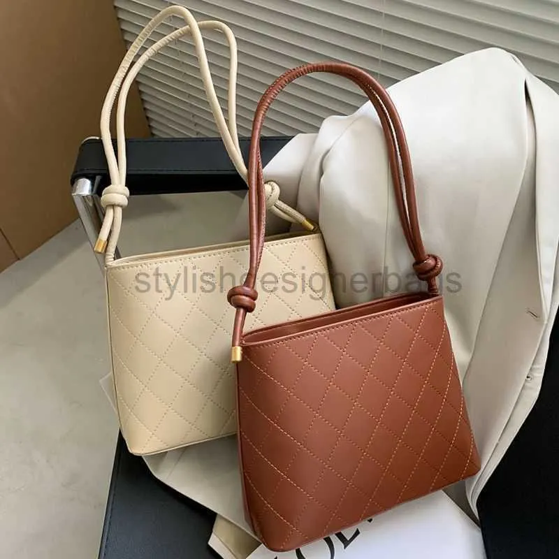 Saco com cordão nicho francês balde de grande capacidade 2023 textura versátil em um ombro temperamento bolsas femininas elegantesdesignerbags