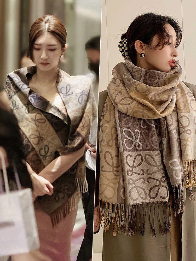 DHgate.com:New Designer Imitation Cashmere Tassel Shawl