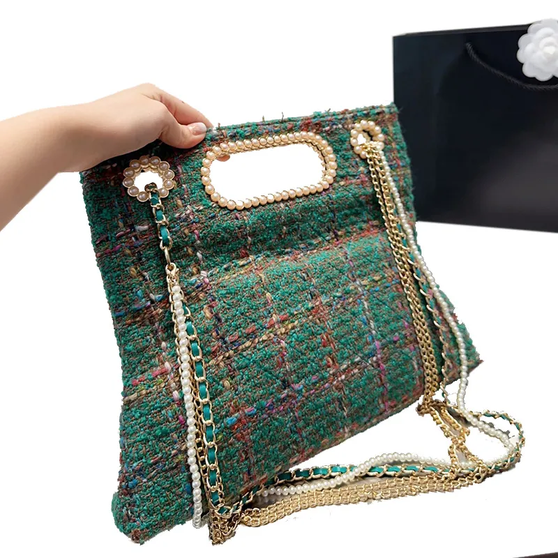 Vrouwenontwerpers klassieke tweed preal schoudertassen handtassen 7a kwaliteit gewikkeld mode parel crossbody ketting tas echte lederen voering bakken luxe ontwerper