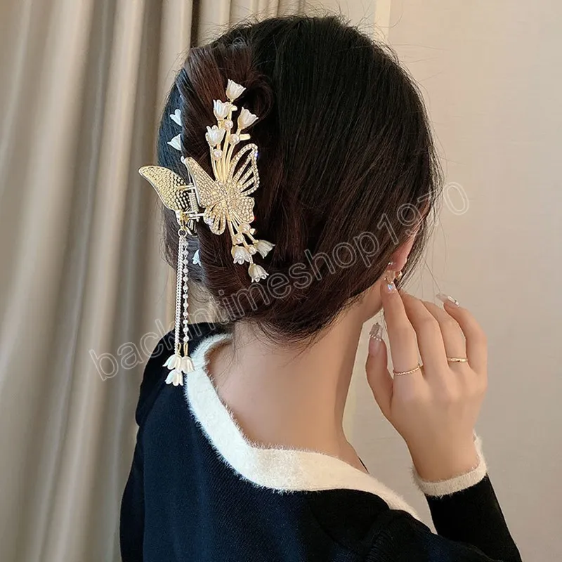 フラワーバタフライタッセルヘアクリップウォームラインストーンパールヘアクローズガールズエレガンスヴィンテージヘッドドレスヘアアクセス