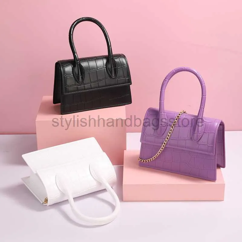 Axelväskor 2023 trapeze het stil hit färg pvc gelé macaroon godis långkedja handväska axel diagonal kvinnlig väska söt crossbodystylishhandbagsstore