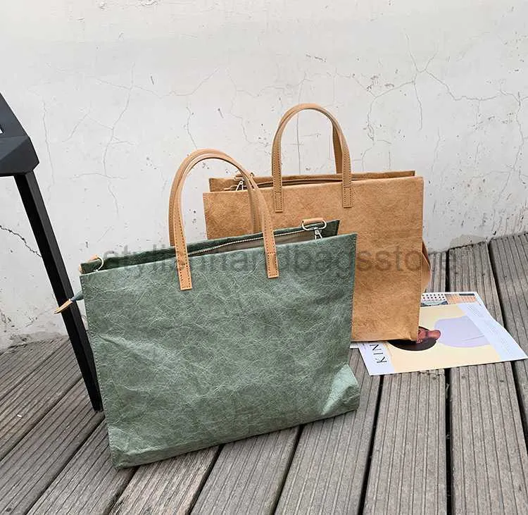 Omuz çantaları lüks moda kadın çantası 2023 yeni kraft kağıt torba taşınabilir banliyö çantası su geçirmez bir omuz tote büyük bagstylishhandbagsstore