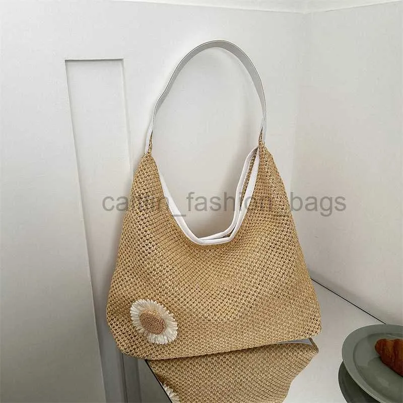 Strandzakken zomer grote capaciteit vrijetijdszak dames strandvakantie geweven tas tas 2023 nieuwe kleine en eenvoudige onderarm tas caitlin_fashion_bags