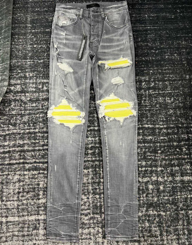 Dżinsy męskie swobodny szczupły mężczyźni projektanci dżinsowe spodnie niszczą kołdrę rozerwane proste kolano żółte skórzane spodnie retro hip hop street spodni