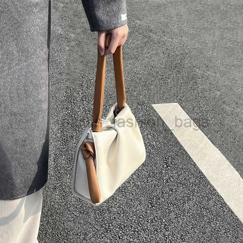 2023 Tidig vår veckad för kvinnors nya stil liten fokus mode kontrast färg crossbody moln vatten hink caitlin_fashion_bags