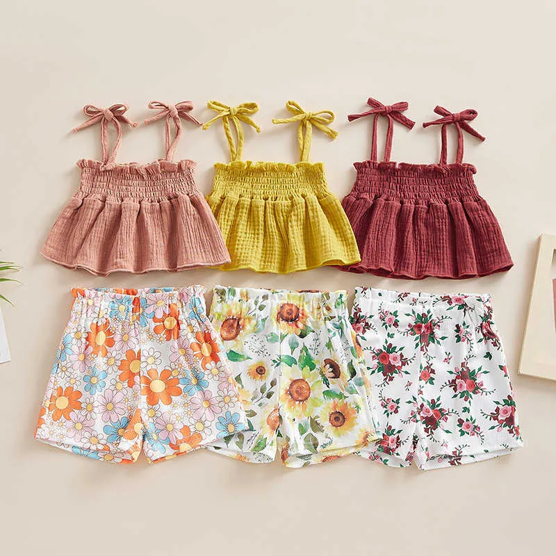 Set di abbigliamento Set di vestiti per bambine per bambini Tinta unita con cinturino per spaghetti senza maniche Canotte altalena e pantaloncini con stampa floreale 2 pezzi