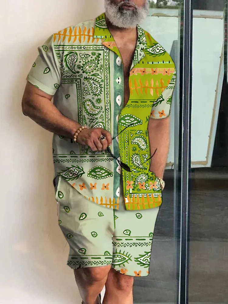 Мужские спортивные костюмы мужчины устанавливают печатные лоскутные отвороты с коротким рукавом. Рубашка для рубашки пляжные шорты летняя уличная одежда гавайских костюмов мужчин S-5XL 230815