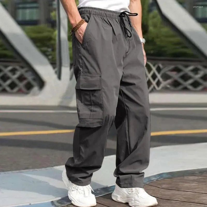 Pantaloni da uomo da campeggio all'aperto multipocchi pantaloni versatili carico elastico cintura hip hop