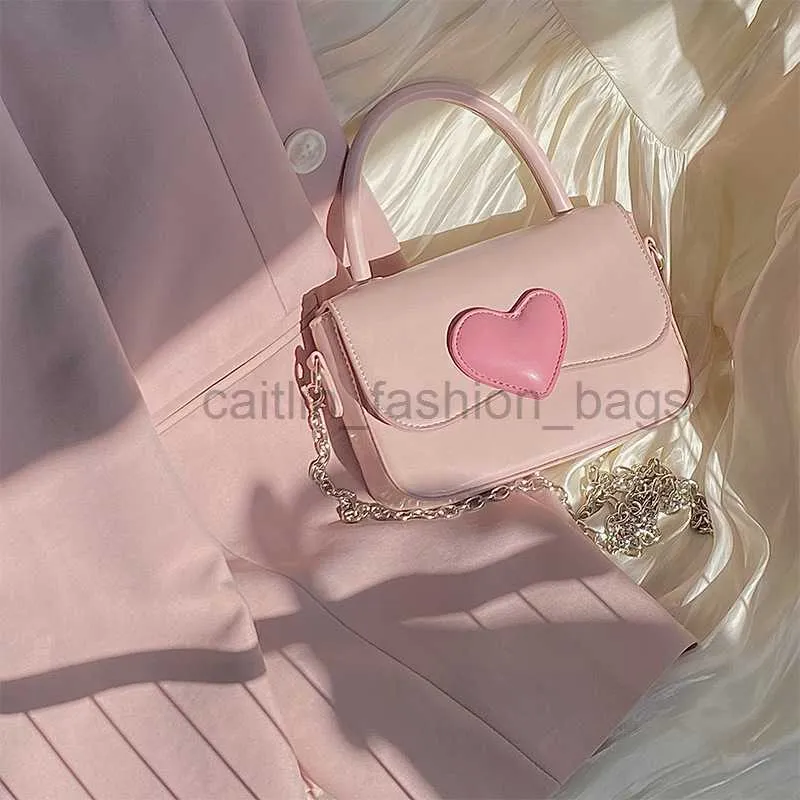 Torba projektantów różowy łańcuch miłosny mały kwadrat dla kobiet 2023 Wersja koreańska High Grade Girl Cute Contrast Color Handheld Crossbody Bag Caitlin_fashion_bags