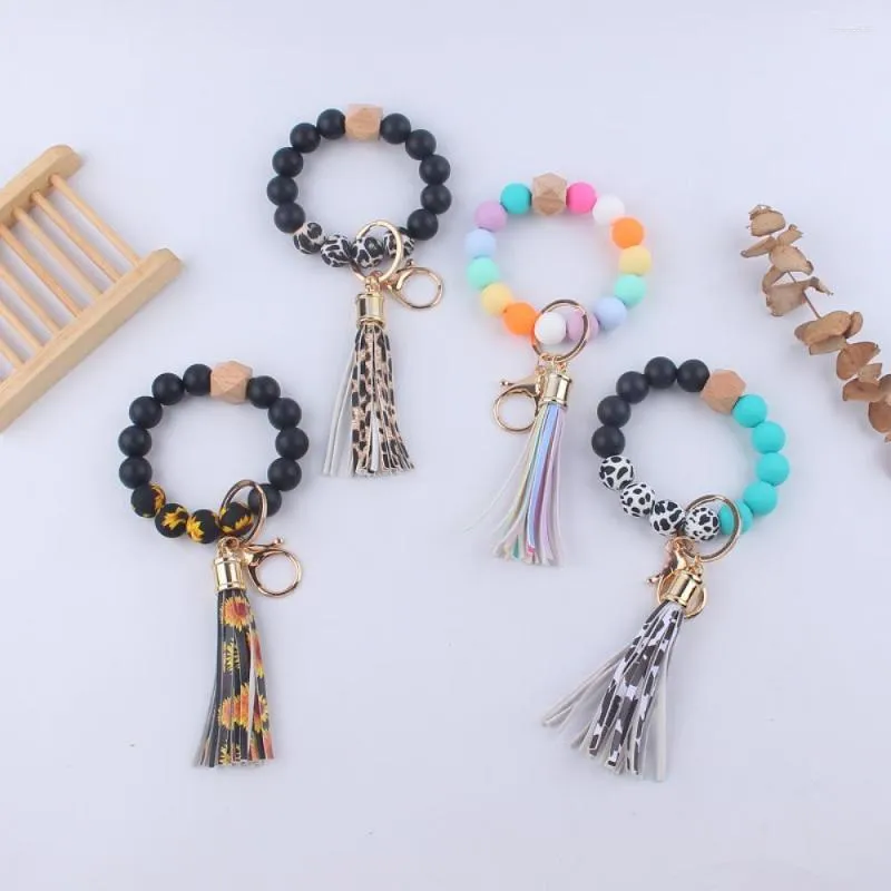Keychains Fashion Pu En cuir Pou Tassel Bracelet Bracelet Kelechain Silicone Leopard Imprime Femmes perlees Bijoux de cles
