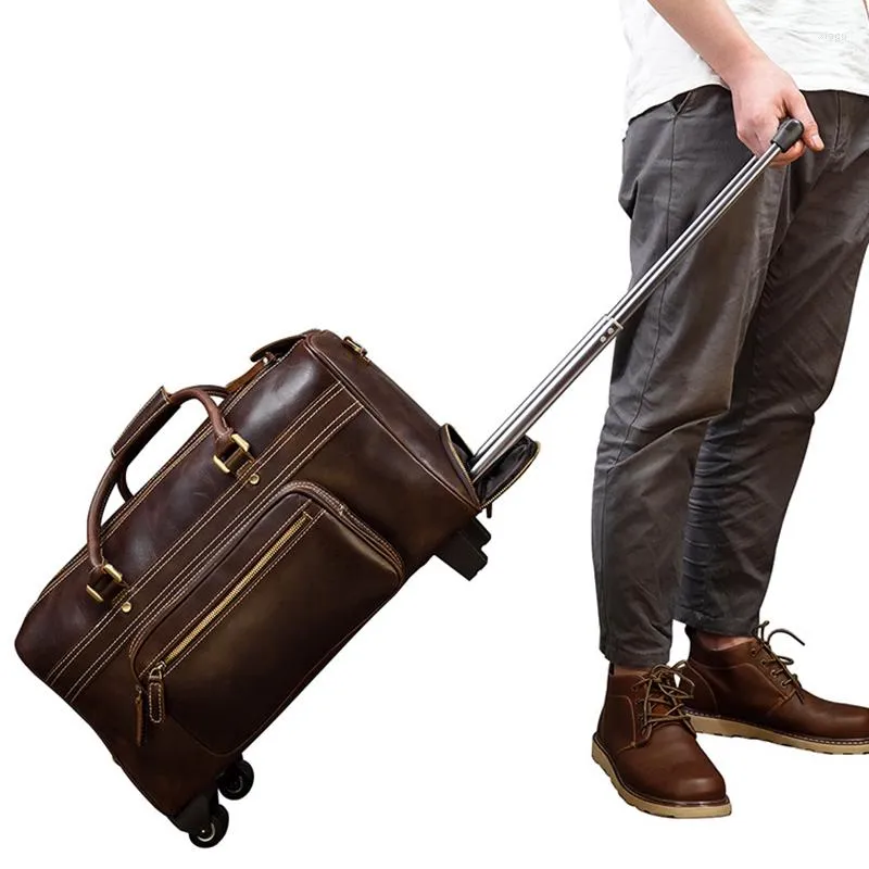 Duffel Bags Män Kvinnor Real Leather Travel Trolley Bag With Wheels Rolling Big Capacity Cowhide Bagage Handväska Weekend Tie Rod resväska