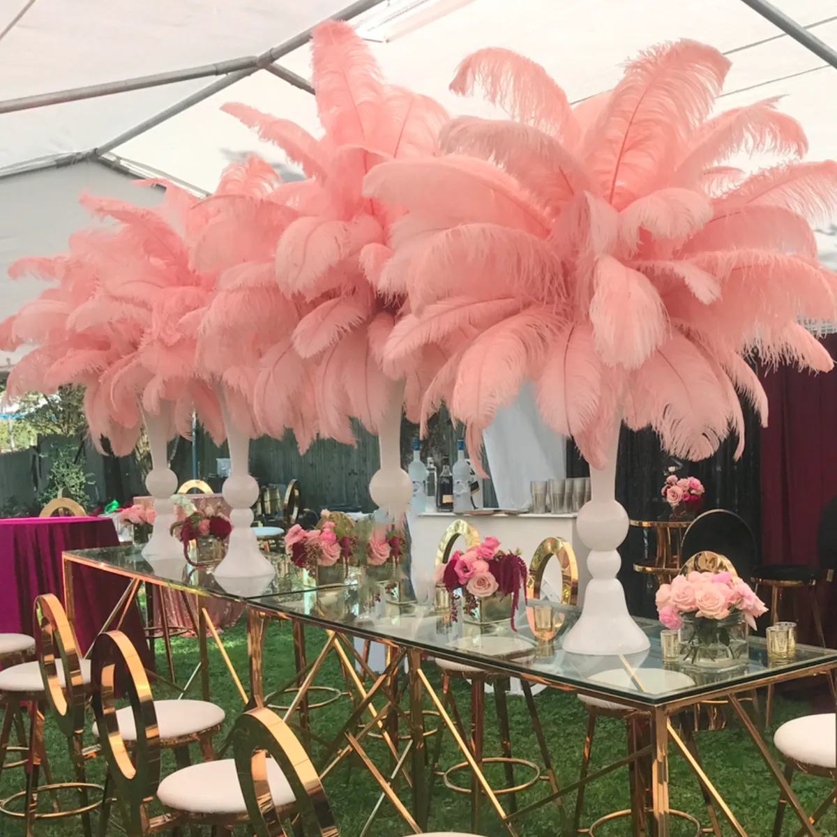 White Metal Flower Stand With Feather Centerpieces And Tall Candle