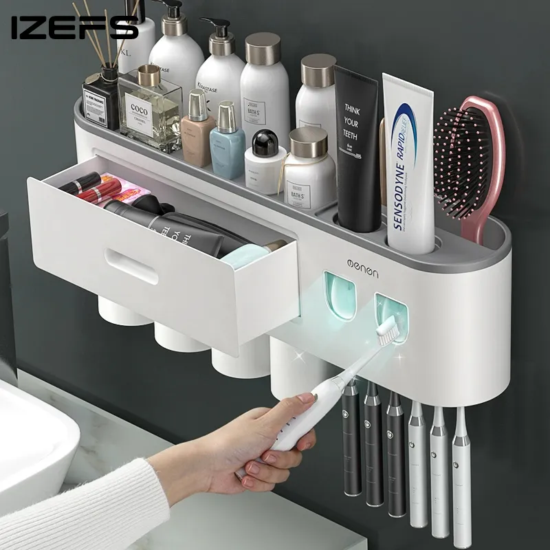Toothbrush Holders IZEFS Magnetic Adsorption Inverted Toothbrush Holder Double Automatic Toothpaste Dispenser Storage Rack Bathroom Accessories Set 230820
