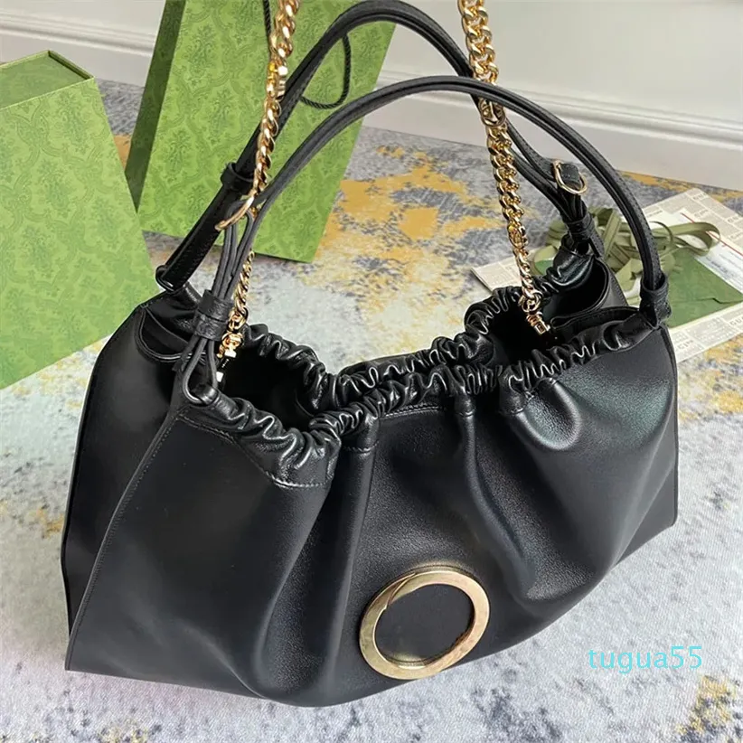 Bolso de compras de gran capacidad Bolso de piel de vaca Bolsos de hombro para mujer Hardware de oro negro Accesorios para letras Monedero cruzado con cadena Bolsillo interno con cremallera