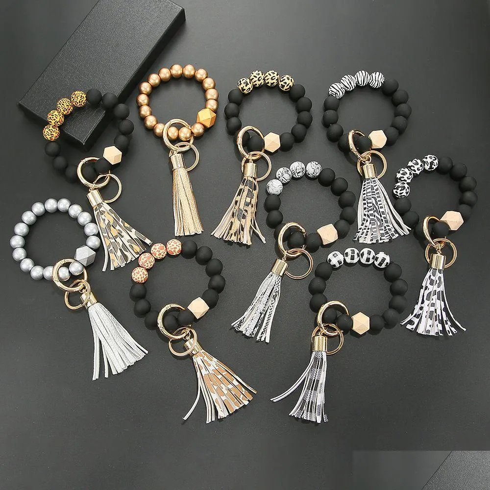 Keychains Lanyards Black Frosted Wooden Bead Bracelet Keychain Fashion Pattern Tassel Pendant Bracelets Women Girl Key Ring Wrist Otgma