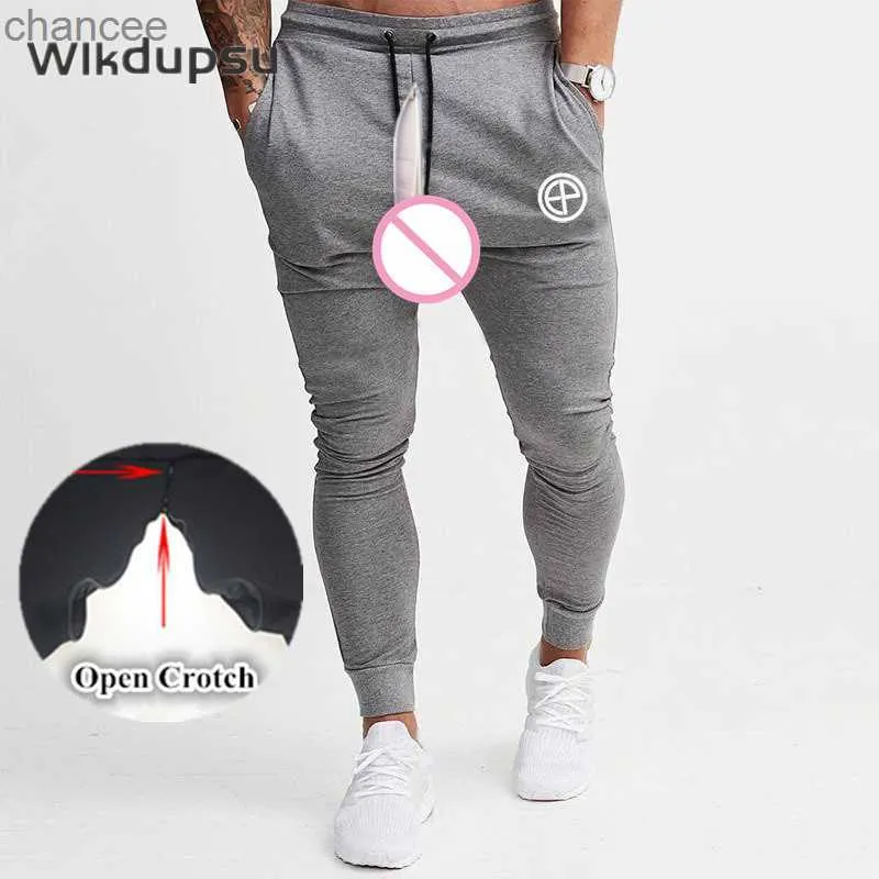 Мужские спортивные костюмы Bottoms Sexy Invisible Double -Zippers Open Coughting Joggers Joggers спортивные спортивные залы тонкие фитнеса тощие брюки для белья20230824.