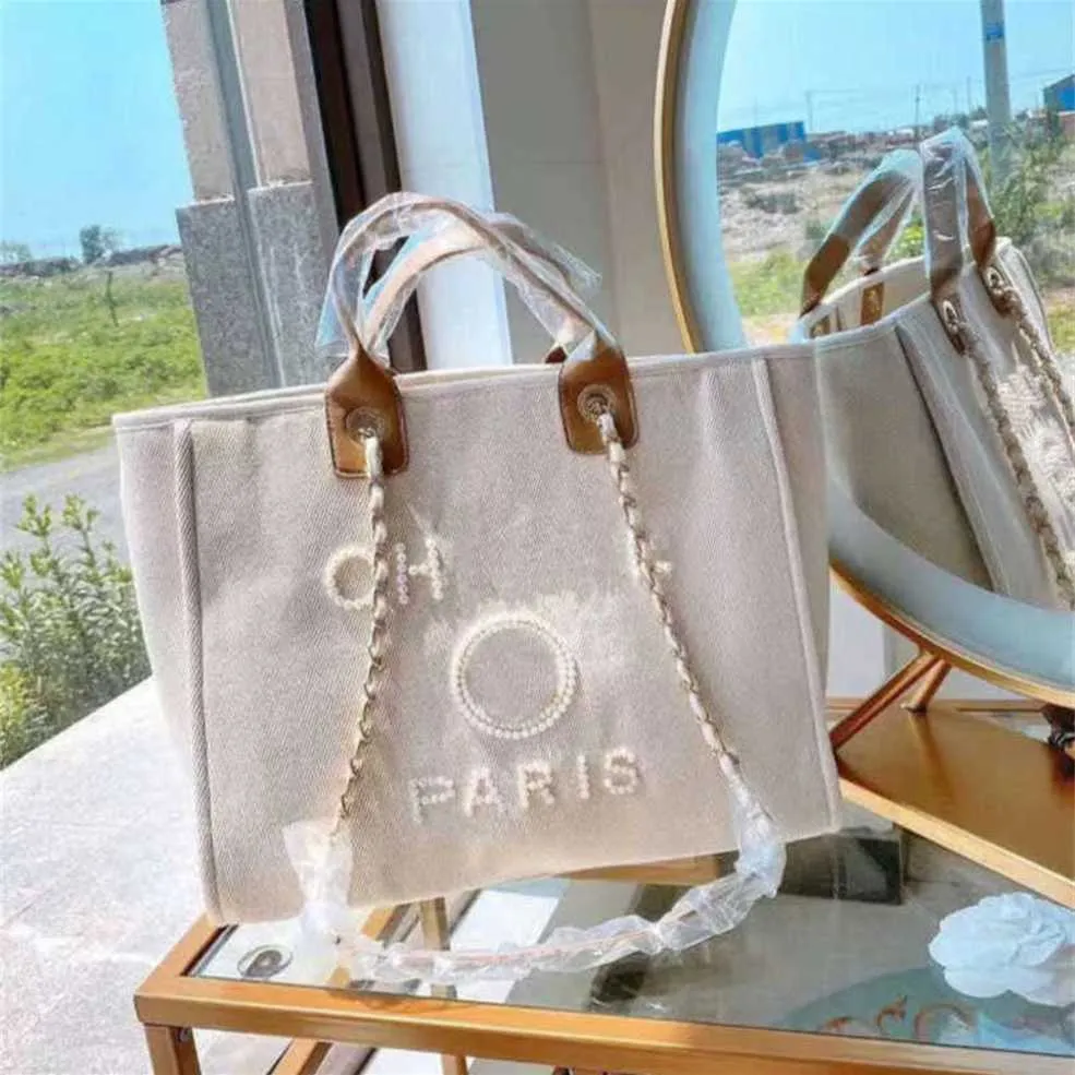 Bolsa de mão de lona de luxo feminina clássica Bolsa de praia Tote Bolsas grandes mochilas capacidade pequena corrente pacotes grandes crossbody Y1M1 bolsas de grife 70% de desconto