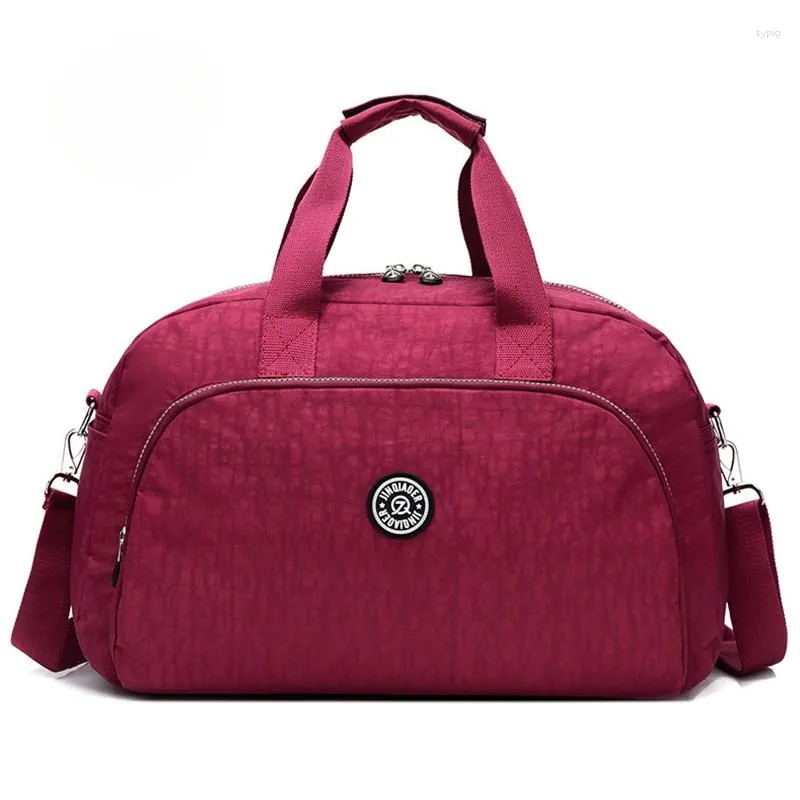 Duffel Bags Nylon Women's Travelling Bag Fashion Bagage Handväskor Travel Kvinnor på hjul