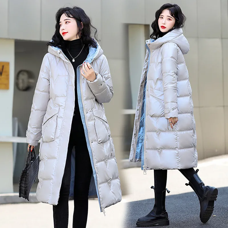 女性の綿のコート