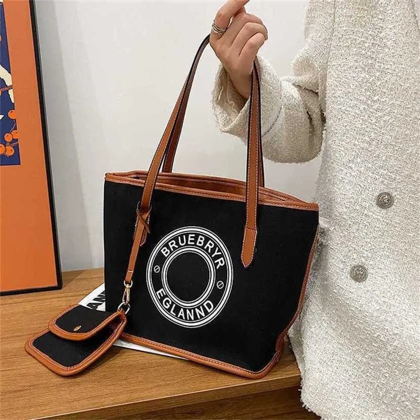 26% DI SCONTO Borsa 2024 Nuovo lancio Borsa a mano da donna Pendolare Vogue Canvas Tote Design piccolo Grande capacità Stampa artistica Lettera One Underarm