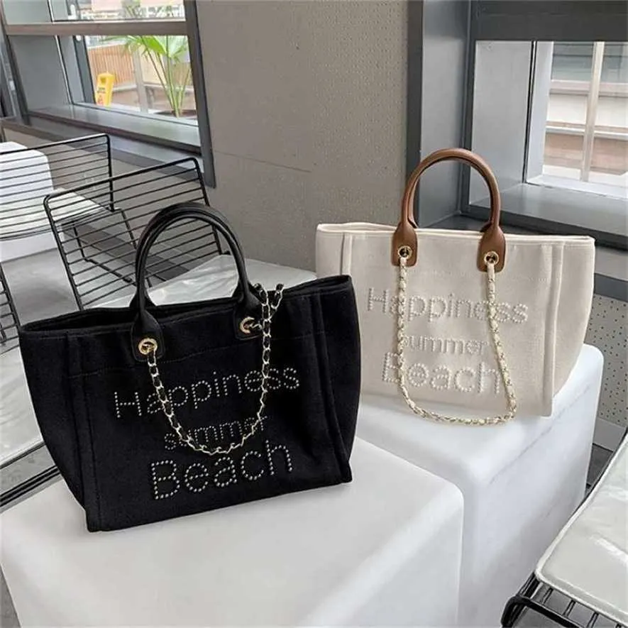 Dégagement des sacs à main 70% de réduction sur les sacs à main bon marché Nouvelle petite toile parfumée avec chaîne à main en cuir Pearl Beach Mommy Sac fourre-tout à une épaule