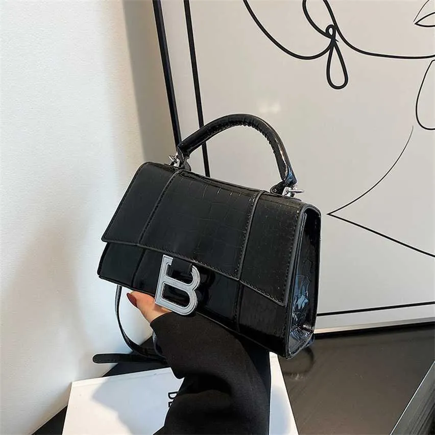 Luxury Handbag Shop 85% de réduction sur le sac à main de luxe sac de conception de niche pour les femmes 2023 été nouveau sablier rouge Internet avec motif de pierre portable une épaule bandoulière