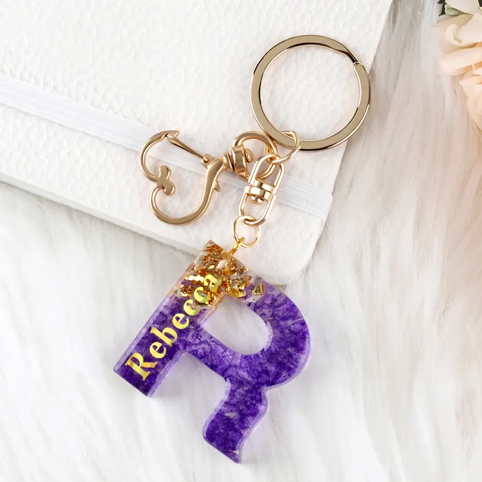 JSRQT Porte-clés Lettre Initiale E, Porte-clés Alphabet En Résine Violettes Pour Femme Filles Avec Pendentif Papillon Et Pompon, Nom Porte-clés