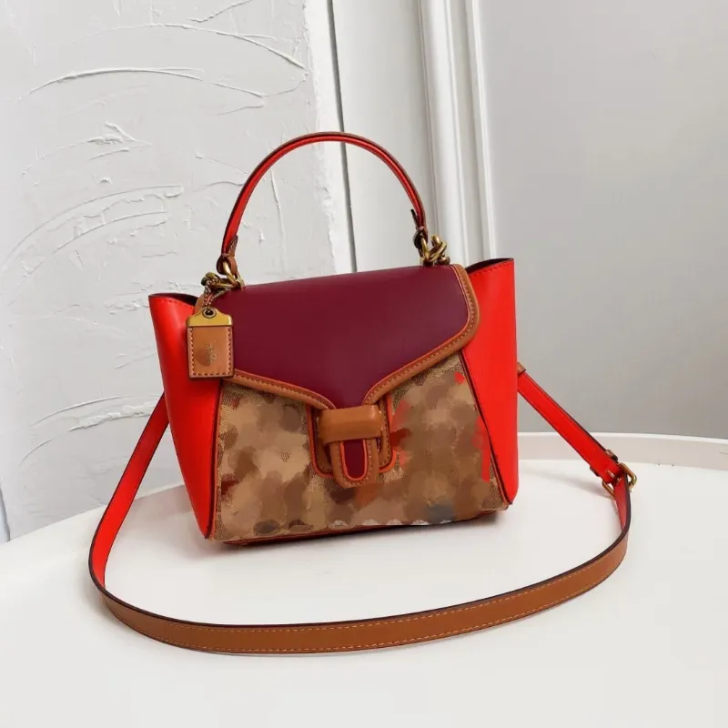 Bolsas de ombro femininas da moda com estampa geométrica combinando com cores