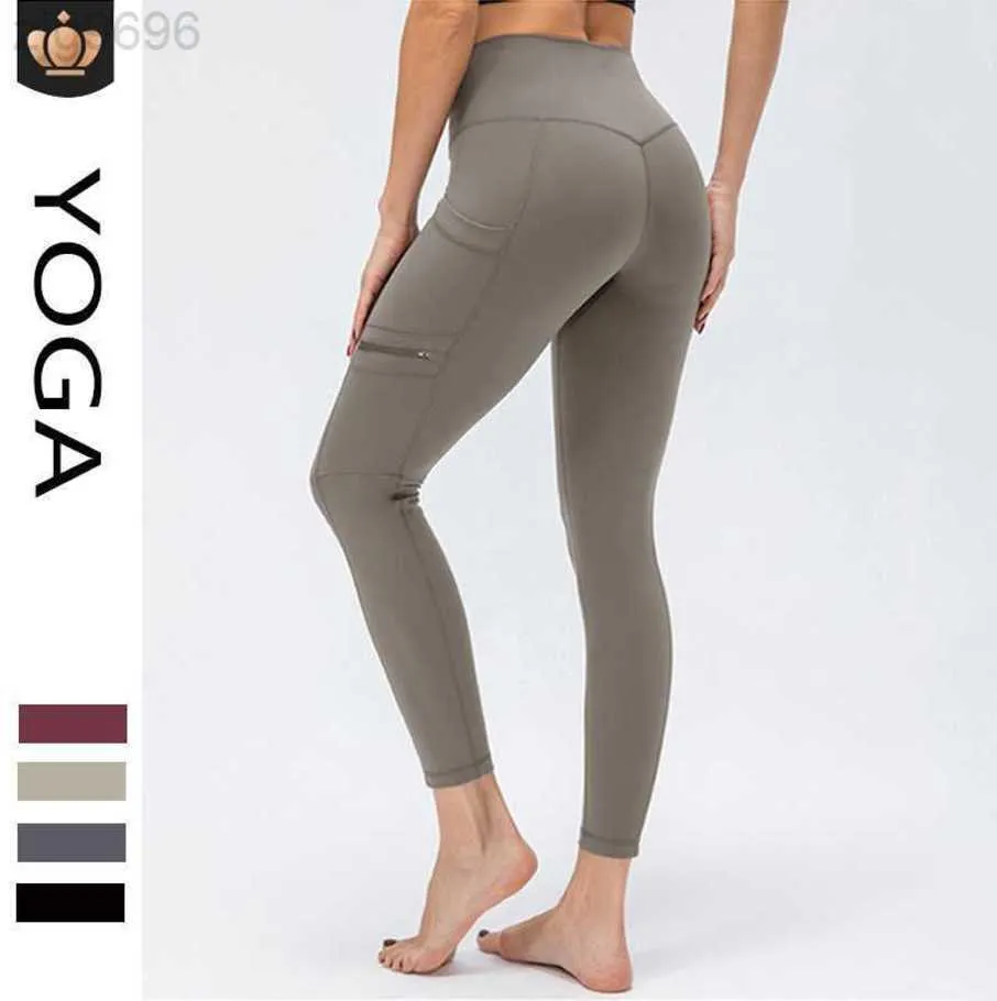 2023 Desginer Al Yoga Fitness Pantalons Taille haute pour femmes Abdominale Hanche Lift Pantalon de sport ajusté Poches latérales en forme de pêche Pantalon de hanche