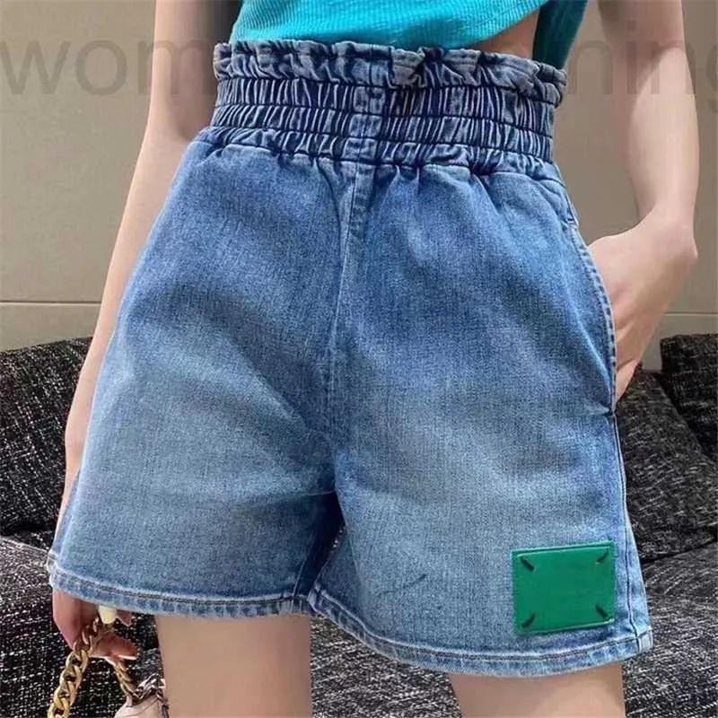 diseñador Diseñador de moda para mujer Pantalones cortos de mezclilla Pantalones vaqueros elásticos de cintura alta Pantalones cortos Grado Ropa de mujer QAFO