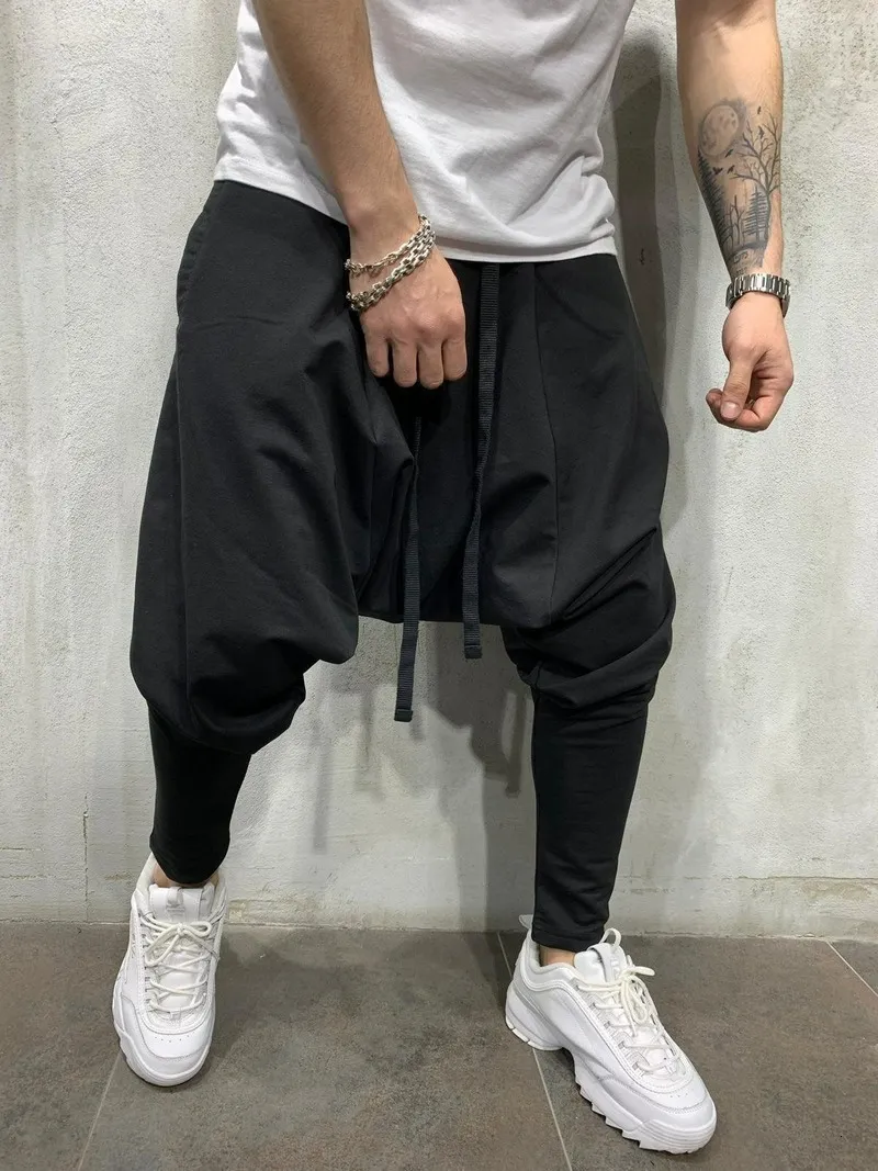 Men s Pants Mens Clothing Hip hop Trend Trousers European American Loose Solid Color Feet Street Sports Casual Harem 230302